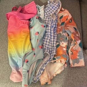 Four Baby Girl One Piece Bathing Suits. Size 12 months